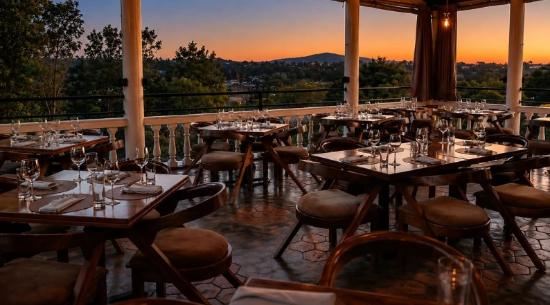Le Petit Chalet terrace overlooking Kigali at sunset